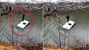 Dereye düşen aracının üzerinde kurtarılmayı bekledi