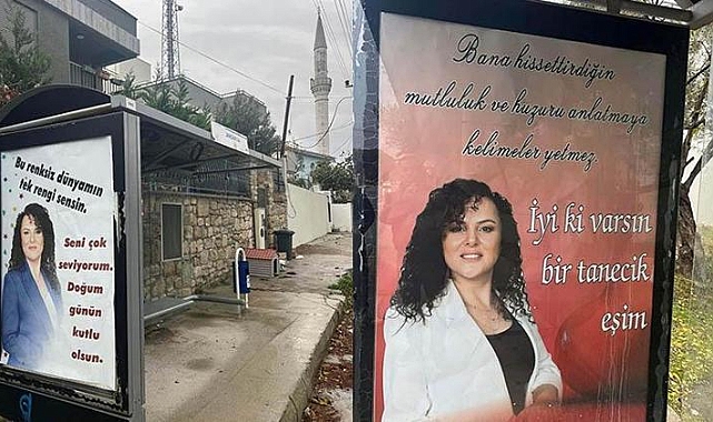 Eşinin doğum gününü otobüs duraklarına astırdığı afişlerle kutladı